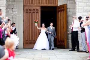 Bride and groom exiting church after wedding