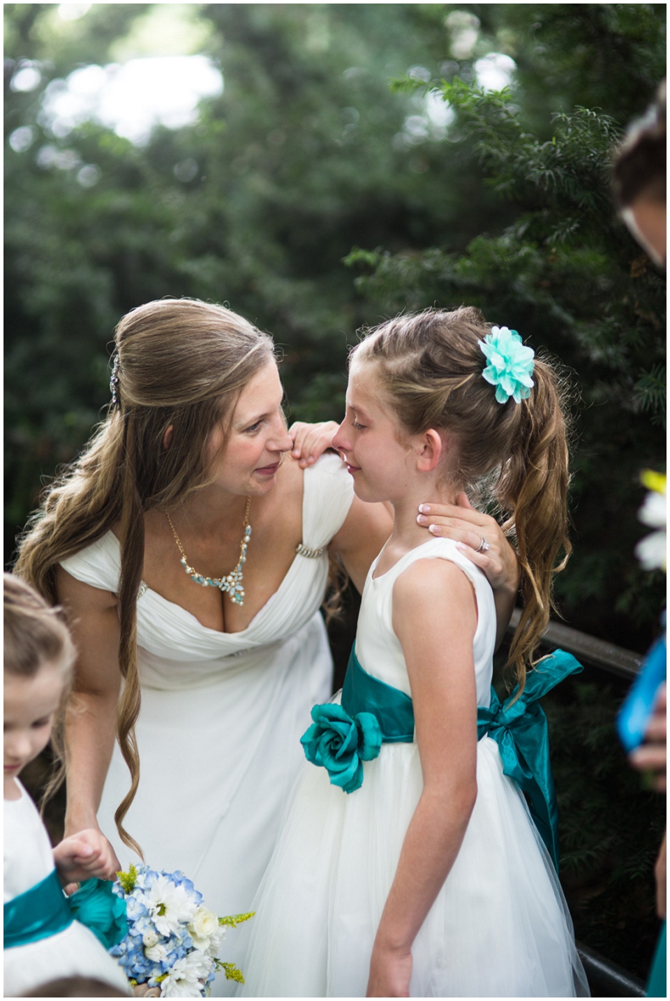 Moment between bride and daughter after wedding ceremony