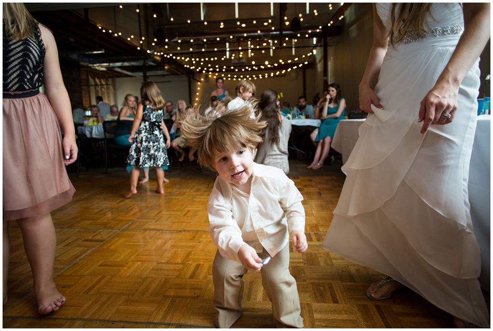 Child dancing during wedding reception